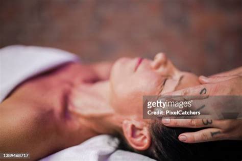 woman giving man massage photos and premium high res pictures getty images