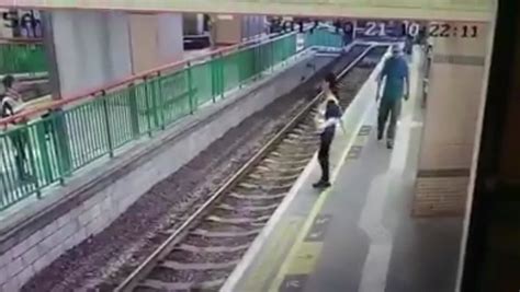 Chilling Moment Man Pushes Cleaner Onto Train Tracks At Station Then Calmly Walks Off World
