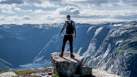 Hd Wallpaper The Best Views Man Sitting On Edge Of Cliff Looking Down