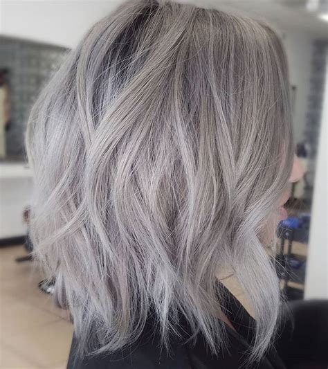 The chic angled cut of a straight lob is a spectacular way to frame a beautiful face. cool ash blonde balayage shades silver shoulder length ...