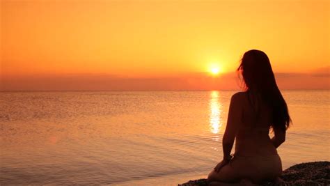 Silhouette Woman Sitting On Beach Sunset Stock Footage Video 100