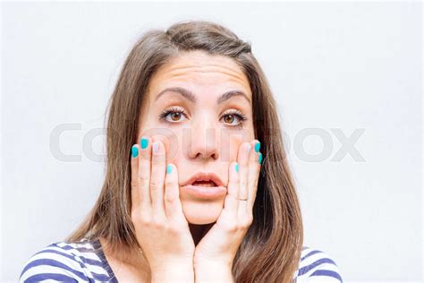 girl touches the skin on cheeks stock image colourbox