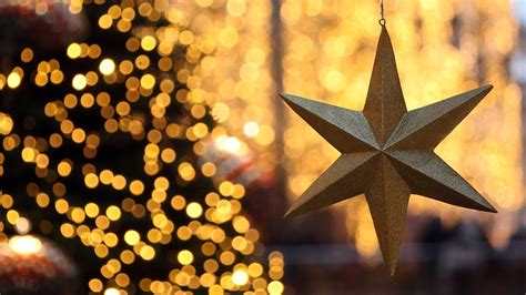 Hanging Golden Star In Bokeh Background Hd Christmas Star Wallpapers