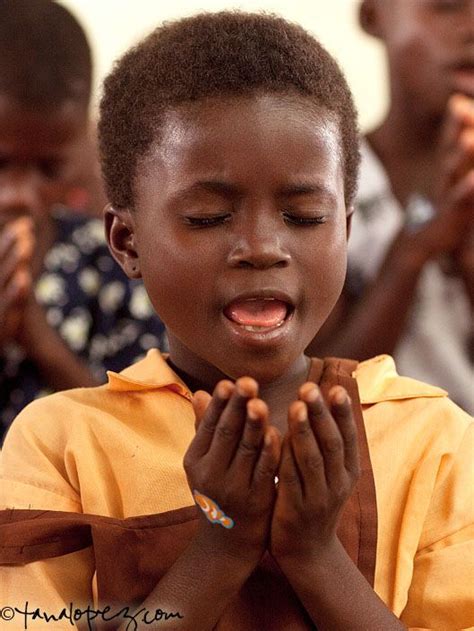 A School Girl Praying In Ghana West Africa