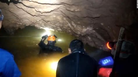 Heavy monsoon rains were filling the cave. Video shows Thai boys' rescue from cave - CNN Video
