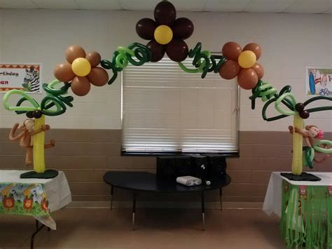 The balloon bouquet includes a large foil balloon that looks like a toucan, round foil balloons featuring tropical designs, a round pink foil balloon, and a round green foil balloon. Capital Balloon Studios: Jungle Themed Balloon Decor for ...