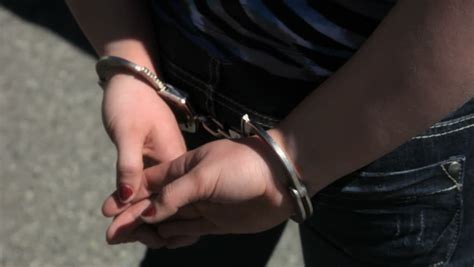 Person Being Handcuffed By A Police Officer Stock Footage Video Shutterstock