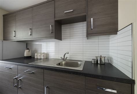 Green and black olives with bottle of olive oil. Fibo unveils new kitchen board range · PHPD Online