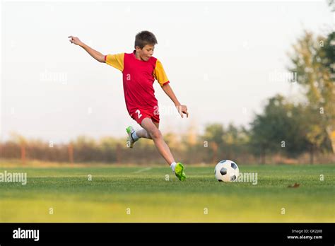 Children Kicking Ball Hi Res Stock Photography And Images Alamy