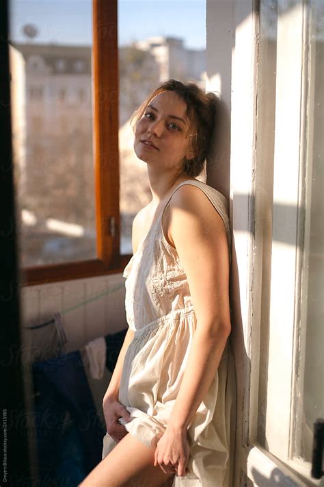 Portrait Of Beautiful Girl Posing On The Balcony By Stocksy Contributor Demetr White Stocksy