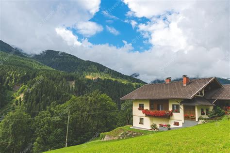Premium Photo Traditional Alpine House In Green Forest Mountains