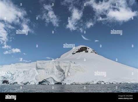 A Landscape Image Of A Typical Mountain Range With A Blue Sky And