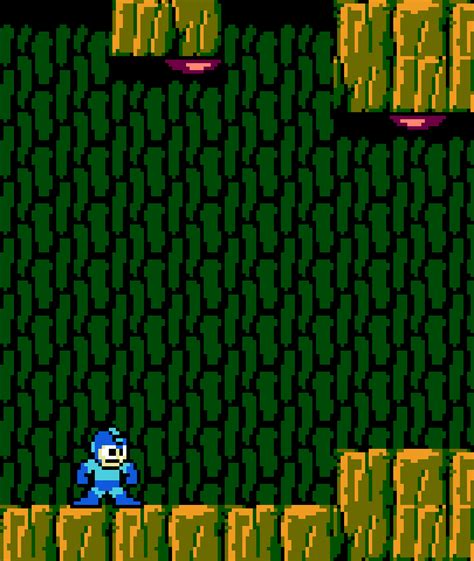 An Old School Video Game With A Blue Man In The Middle And Green