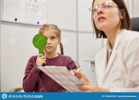 Little Girl Reading Eye Chart At Vision Test Stock Photo Image Of