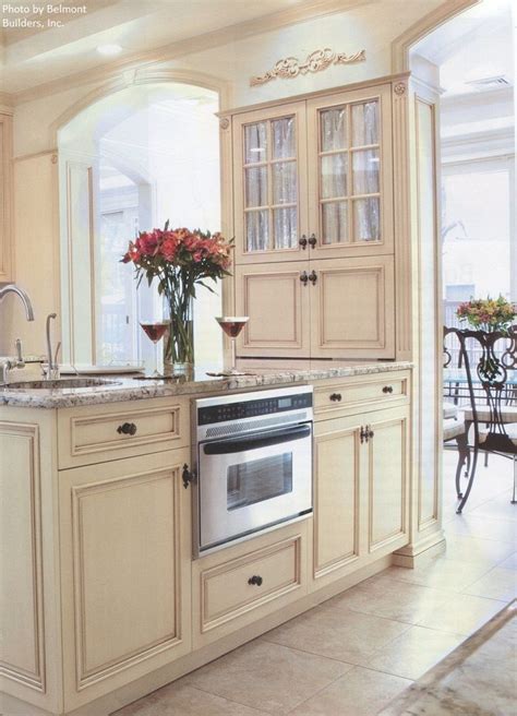 Do you suppose kitchen cabinet repainting cost appears to be like nice? An old world kitchen with silver arched neck faucet, light ...