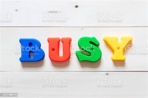 Letter Block In Word Busy On White Wood Background Stock Photo