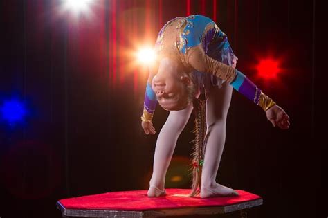 Premium Photo A Girl With A Flexible Body Performs A Circus Artist