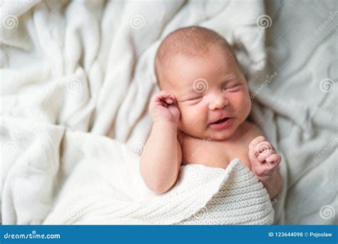 Sleeping Newborn Baby Lying On Bed Covered By A White Blanket Top