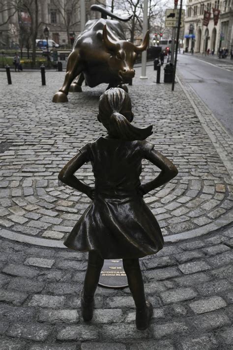 Defiant Girl Challenges Charging Bull In Ny Financial District On