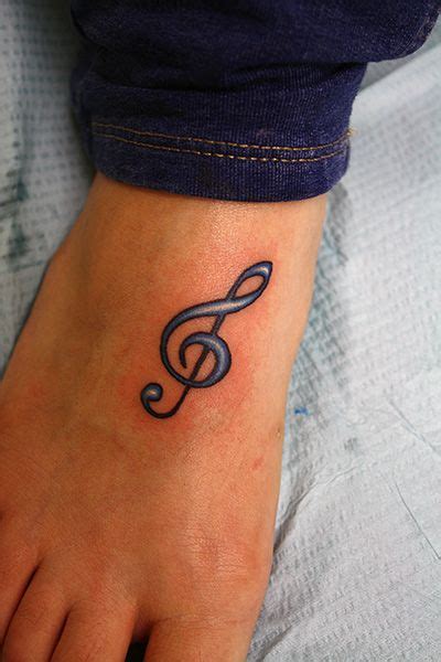 Many music tattoo ideas come from the heart, from a memory and a time which has passed, but is forever on your mind. treble_cleff_tattoo | Music tattoos, Treble clef tattoo, Foot tattoos