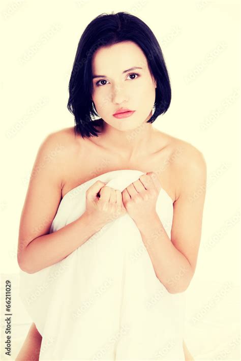 Sexy Nude Woman Covering Her Body With Sheet Stock Photo Adobe Stock