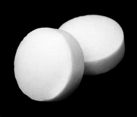 Bats can get too close for comfort as you may find them in your attic, swarming around your home, getting stuck indoors, odor from droppings as well as other inconveniences they can cause. White naphthalene balls over dark background.