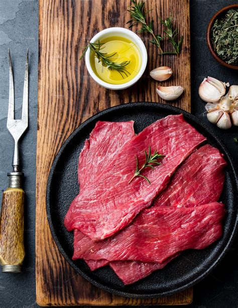 Fresh Raw Meat Beef Steaks Beef Tenderloin In Cast Iron Pan On Wooden