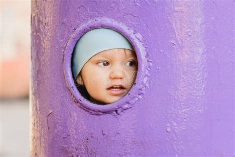 Cute Baby Looking Into A Round Hole Stock Photo Image Of Close Game