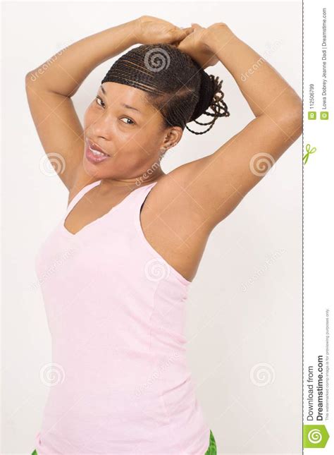 Smiling Woman In Lingerie Showing Shaved Armpit On Light Background