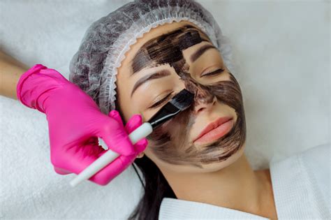 Closeup Of Carbon Peeling Procedure For Middleaged Woman Face Laser
