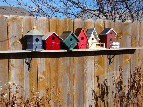Colorful Bird House Mounted On Wooden Fences Decorative Bird Houses