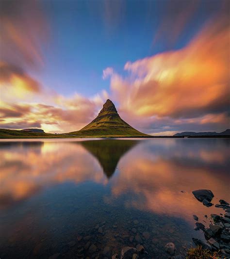 Sunset Over Kirkjufell Mountain With Reflection In A Nearby Lake In