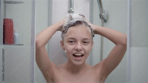 Smiling Young Girl Bathing Under A Shower At Home Beautiful Teen Girl