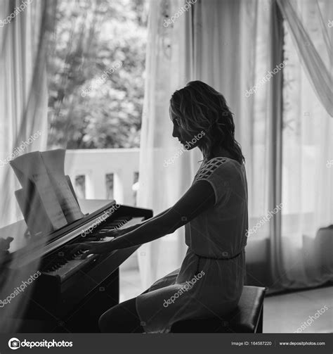 Woman Playing Piano — Stock Photo © Olsin 164587220