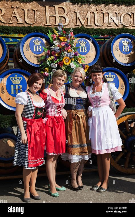 Germany Bavaria Munich Oktoberfest Girls In Traditional Bavarian Costume In Front Of Beer