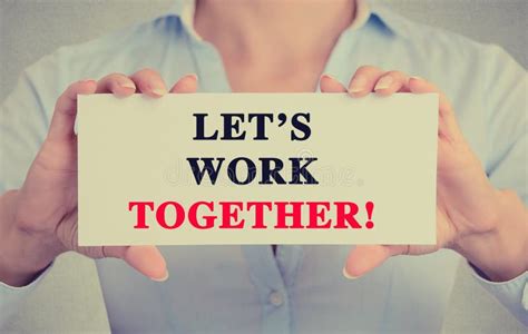 Businesswoman Hands Holding Card Sign With Let S Work Together Stock