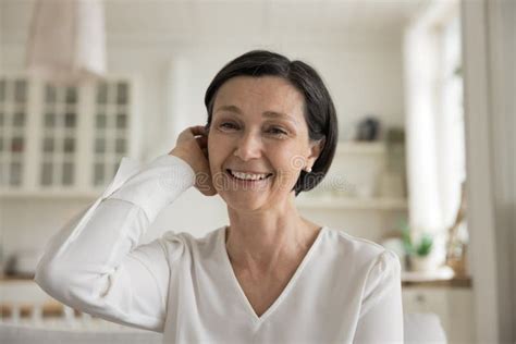 happy mature brunette lady home screen head shot portrait stock image image of head home