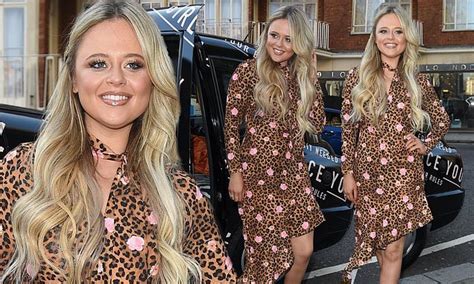 emily atack flashes a lot of leg in a frilled leopard print dress