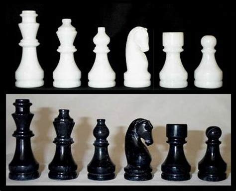 Replacement Black and White Marble Chess Pieces Only - Large 4k00.29chess pieces is standing on glass board.