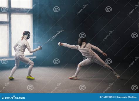 A Fencing Training Two Women Having A Duel Stock Photo Image Of Singlestick Rivals