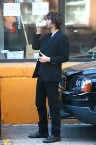 Keanu Reeve Striks A Sad Figure Again As He Smokes Outside