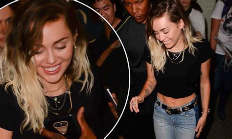 Miley Cyrus Shows Off Toned Tummy In Black Crop Top Daily Mail Online