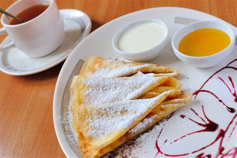 Tea And Pancakes With Powdered Sugar Stock Image Image Of Dishware