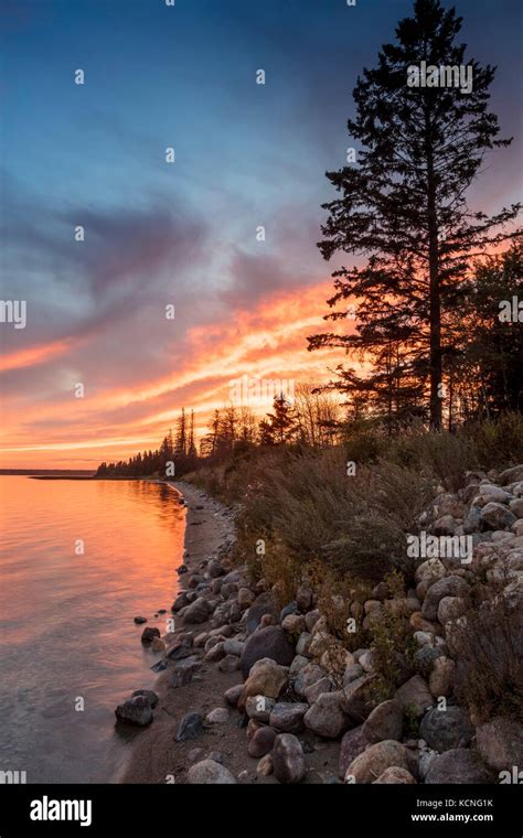 Sunset Over Clear Lake In Riding Mountain National Park Hi Res Stock