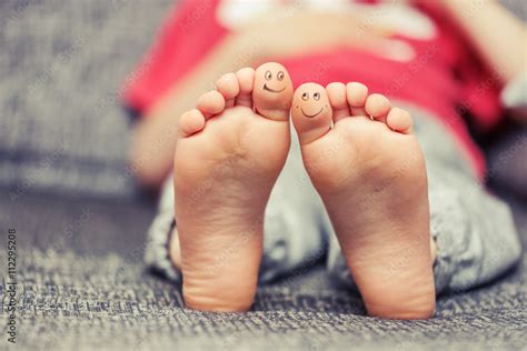 Kids Feet With Smiley Faces Drawings Stock Photo Adobe Stock