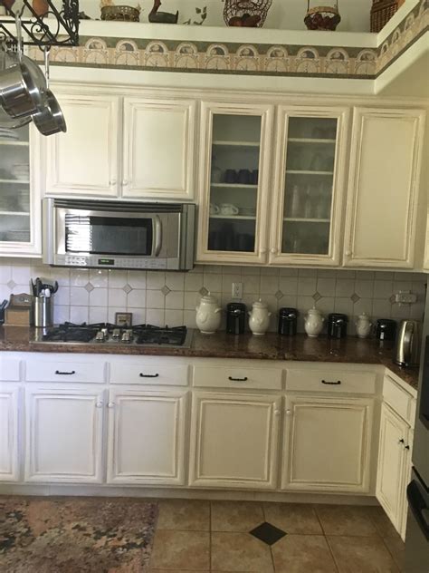 Custom white oak cabinets by woodharmonic. Builder's oak cabinets painted white and distressed ...