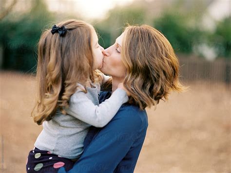 Mother And Daughter Kissing Each Other By Stocksy Contributor Jakob Lagerstedt Stocksy