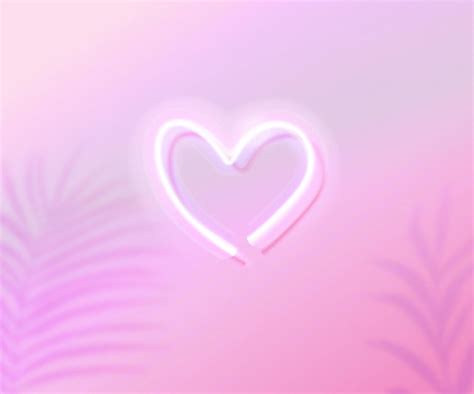 Premium Vector Neon Heart Glowing On Pink Gradient Background With