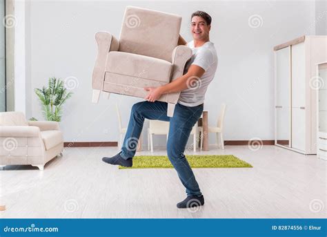 The Man Moving Furniture At Home Stock Photo Image Of Professional