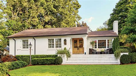 This landscaping design idea is perfect for suburban homes. A Dramatic Ranch House Renovation - Southern Living